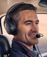 male pilot flying plane wearing Bose headset