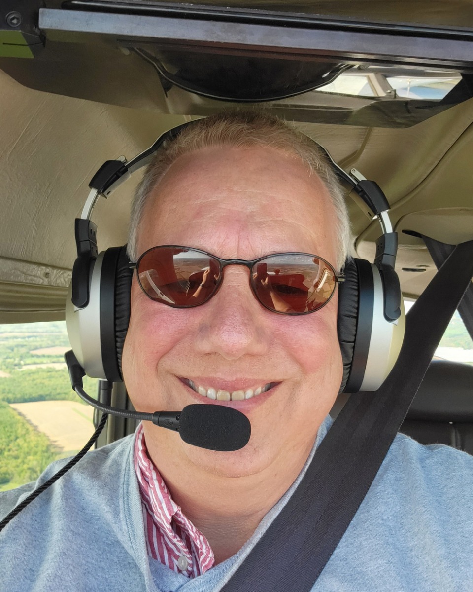 Paul Jurgens flying plane with Lightspeed headset